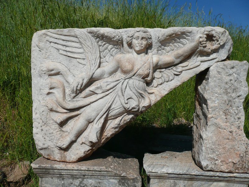 Ancient Greek Relief Of Nike Adjusting Sandal