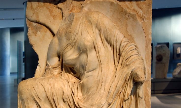 Ancient Greek Relief Of Nike Adjusting Sandal