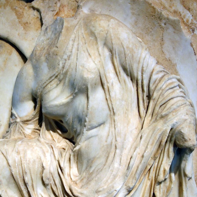 Ancient Greek Relief Of Nike Adjusting Sandal