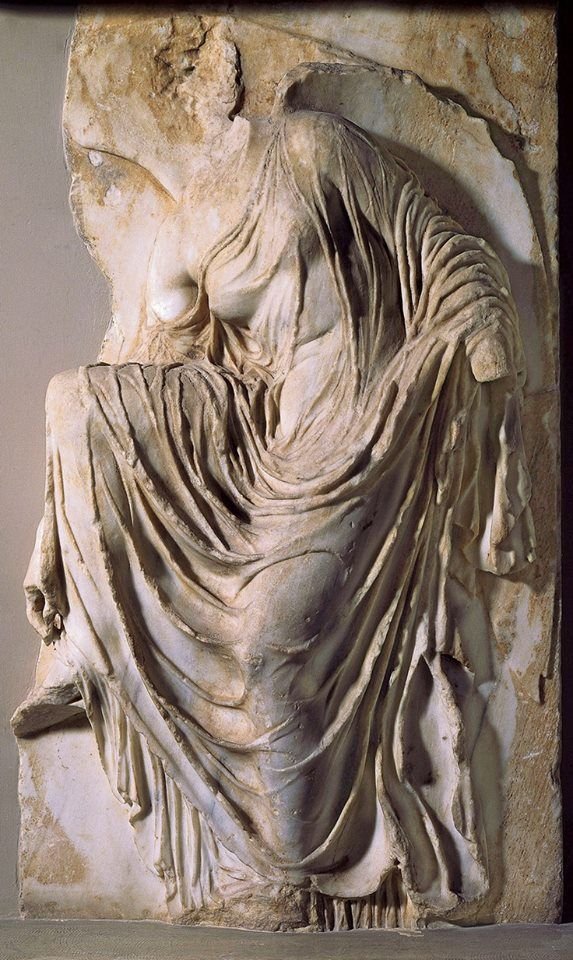Ancient Greek Relief Of Nike Adjusting Sandal